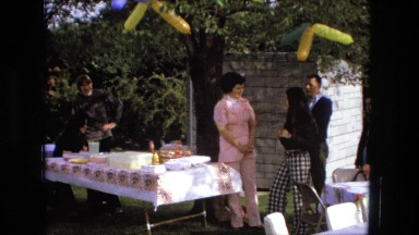 1974: father is seen playing with children FORT WAYNE, INDIANA