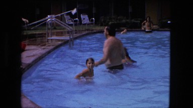 1974: young girl swimming and playing in pool. FORT WAYNE, INDIANA
