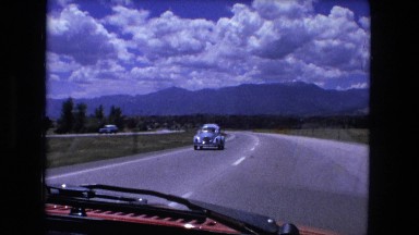 1974: beautiful mountain ridge as seen through the window of moving vehicle