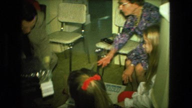1974: grandmother receives record player and opens it while her family looks