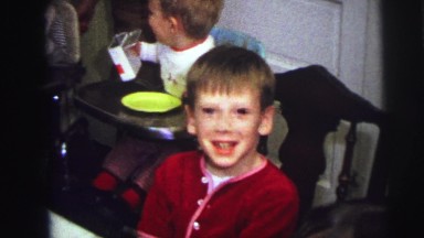 1973: cute kids at kitchen table family time modest middle class living