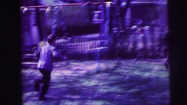 1973: kids running in suburban home's yard LYNBROOK, NEW YORK