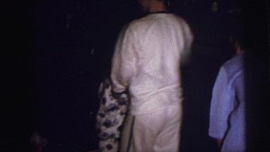 1973: xmas morning kids shuffling to get gifts in pajamas LYNBROOK, NEW YORK