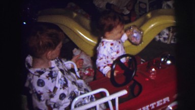 1973: christmas tree is seen with child opening presents LYNBROOK, NEW YORK