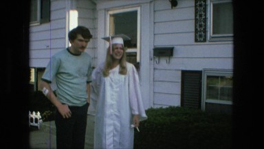 1974: high school graduation day daughter dad outside family bungalow home