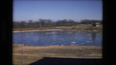 1974: view of people walking on frozen lake FORT WAYNE, INDIANA