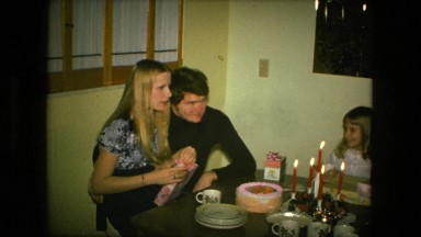 1974: happy birthday mom family sitting dinner table gift birthday party