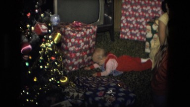 1974: xmas family baby fun family seated floor FORT WAYNE, INDIANA