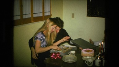 1974: young wife gets kitchen apron gift opens and puts on FORT WAYNE, INDIANA