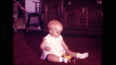 1974: baby eating cereal brother steals piece and gives kiss in return