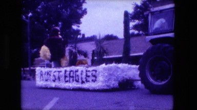 1974: parade float being pulled through the street by tractor FORT WAYNE