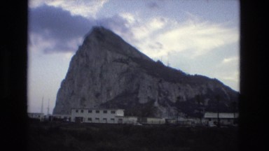 1978: beautiful old town sits next to mountain and is visited by tourists.