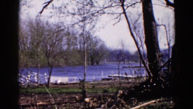 1960: view of lake and several docks in the fall with wind blowing