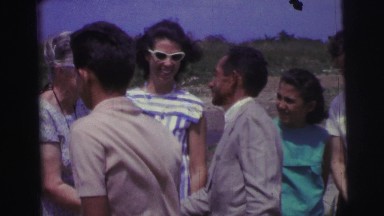 1967: fashionable young women shake hands with young men. BRAZIL