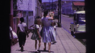 1967: single mother with gaggle of children walking some sidewalk BRAZIL