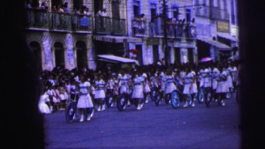 1967: parade of women pushing bicycles with blue wheels on street BRAZIL