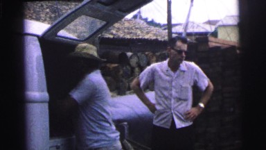 1967: man unloading boxes of supplies from delivery truck BRAZIL