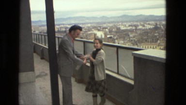 1978: Handshaking on the Top of Building with View of City Italy