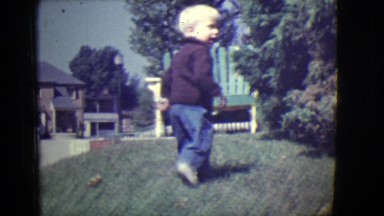 1946: Little Boy Walking and Playing Outdoor Detroit, Michigan