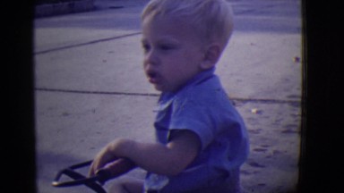 1946: blonde cute kid playing in street with neighborhood friends DETROIT