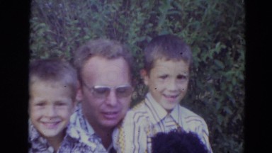 1974: Man with Children and Puppy Lincoln, Nebraska