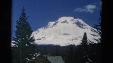 1958: vacation resort switzerland icy mountain vista with pine trees WYOMING