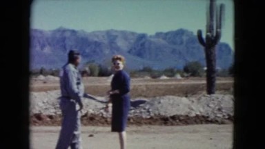 1960: people walking in arizona next to mountain and cactus NEW MEXICO