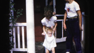 1962: family taking children for walk in the frontyard HAGERSTOWN, MARYLAND