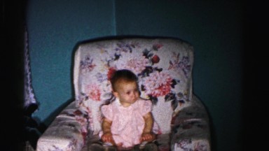 1962: baby sitting on couch relaxing like shes adult HAGERSTOWN, MARYLAND