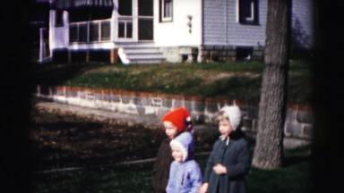 1962: three kids are waiting on the street HAGERSTOWN, MARYLAND