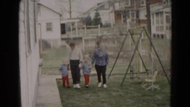 1962: family holding hands walking past playground swingset park HAGERSTOWN