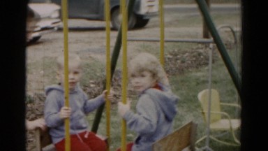 1962: two brothers being pushed on swing HAGERSTOWN, MARYLAND