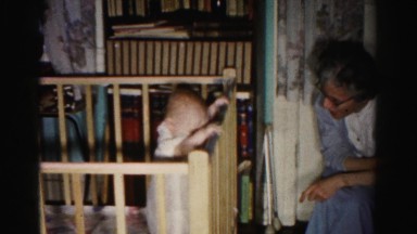 1962: old woman in room talking to baby standing in crib HAGERSTOWN, MARYLAND