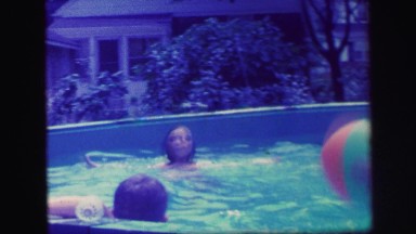 1972: mom plays with kids in the pool LYNBROOK, NEW YORK