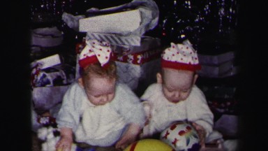 1972: two little girls opening their gifts on christmas LYNBROOK, NEW YORK