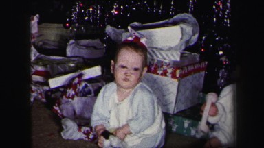 1972: Twin Babies Playing on Floor with Toys Under Christmas Tree LYNBROOK