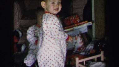 1972: mother and twin babies playing with new christmas toys LYNBROOK, NEW YORK