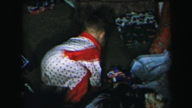 1972: little boy is playing with his christmas toys LYNBROOK, NEW YORK