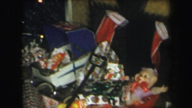 1972: beautiful christmas tree surrounded by stacks of gifts LYNBROOK, NEW YORK