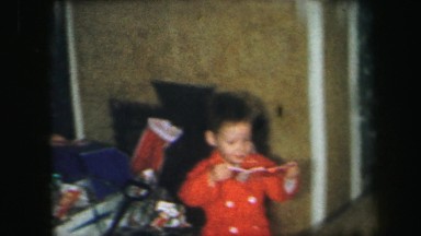 1972: kids having fun on christmas playing with toys opening LYNBROOK, NEW YORK