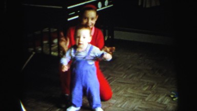 1972: Girl and Her Little Brother Making Funny Faces and Clapping LYNBROOK