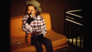 1972: beautiful little girl dressed up in western attire holding gun LYNBROOK