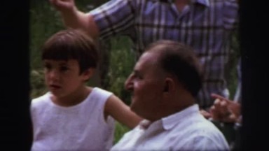 1972: young girl spending time with family outdoor picnic times LYNBROOK