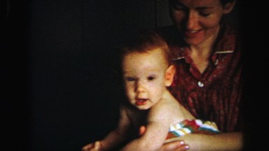 1972: cute redhead baby boy playing mother LYNBROOK, NEW YORK