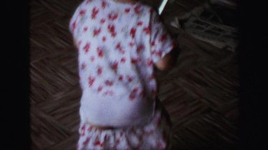 1972: funny kid with loose pants is walking in the room LYNBROOK, NEW YORK