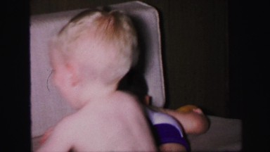 1972: two young boys play on couch LYNBROOK, NEW YORK