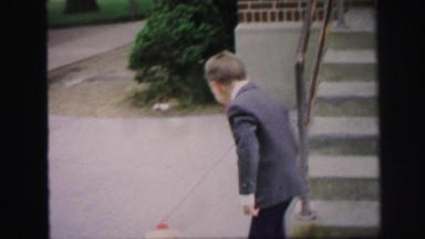1972: proud little man on his very windy elementary school graduation day