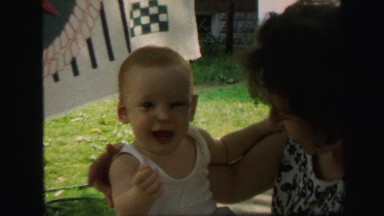 1972: redhead baby ginger playing mother outdoor back porch area LYNBROOK