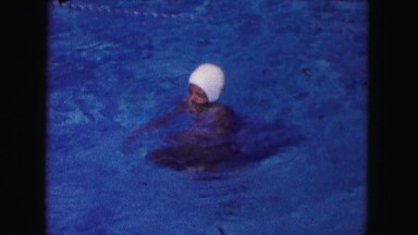 1960: girl swimming pool white swimcap practice bobbing up and down FLORIDA