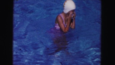 1960: young girl wearing swim cap in a pool FLORIDA